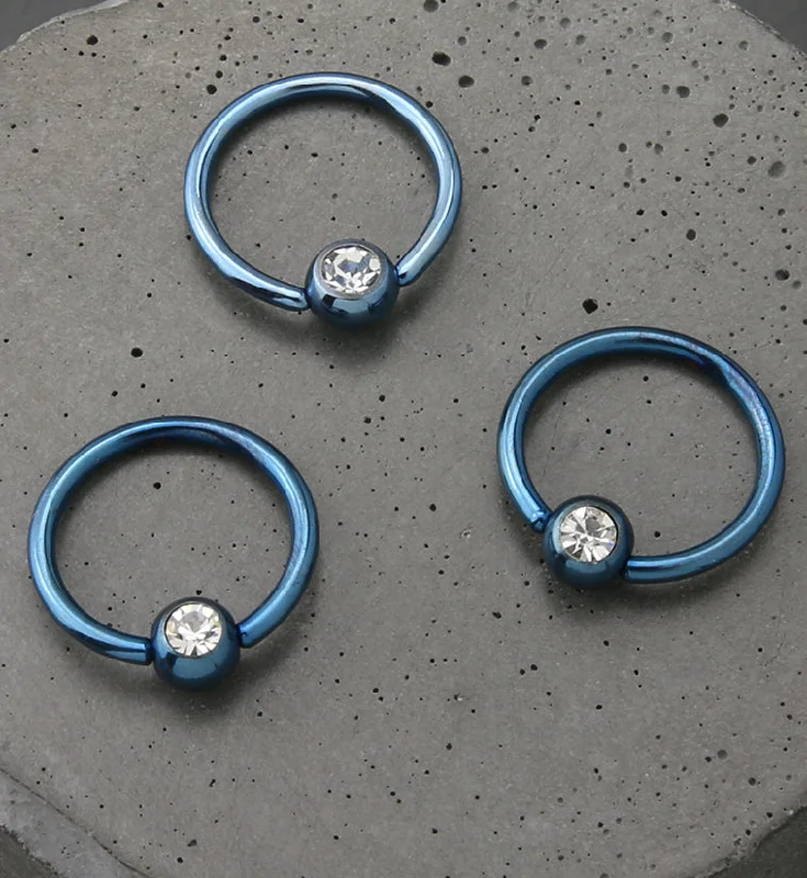 Women's gift rings-Light Blue PVD Clear CZ Captive Ring