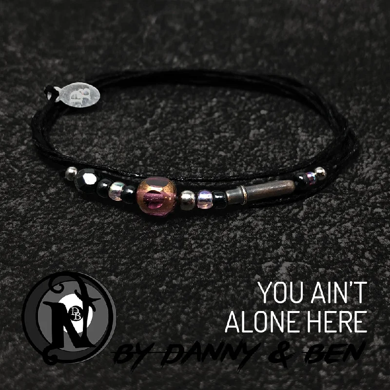 Minimalist women's bangles-You Ain't Alone Here Candlelight NTIO Bracelet by Danny Worsnop & Ben Bruce